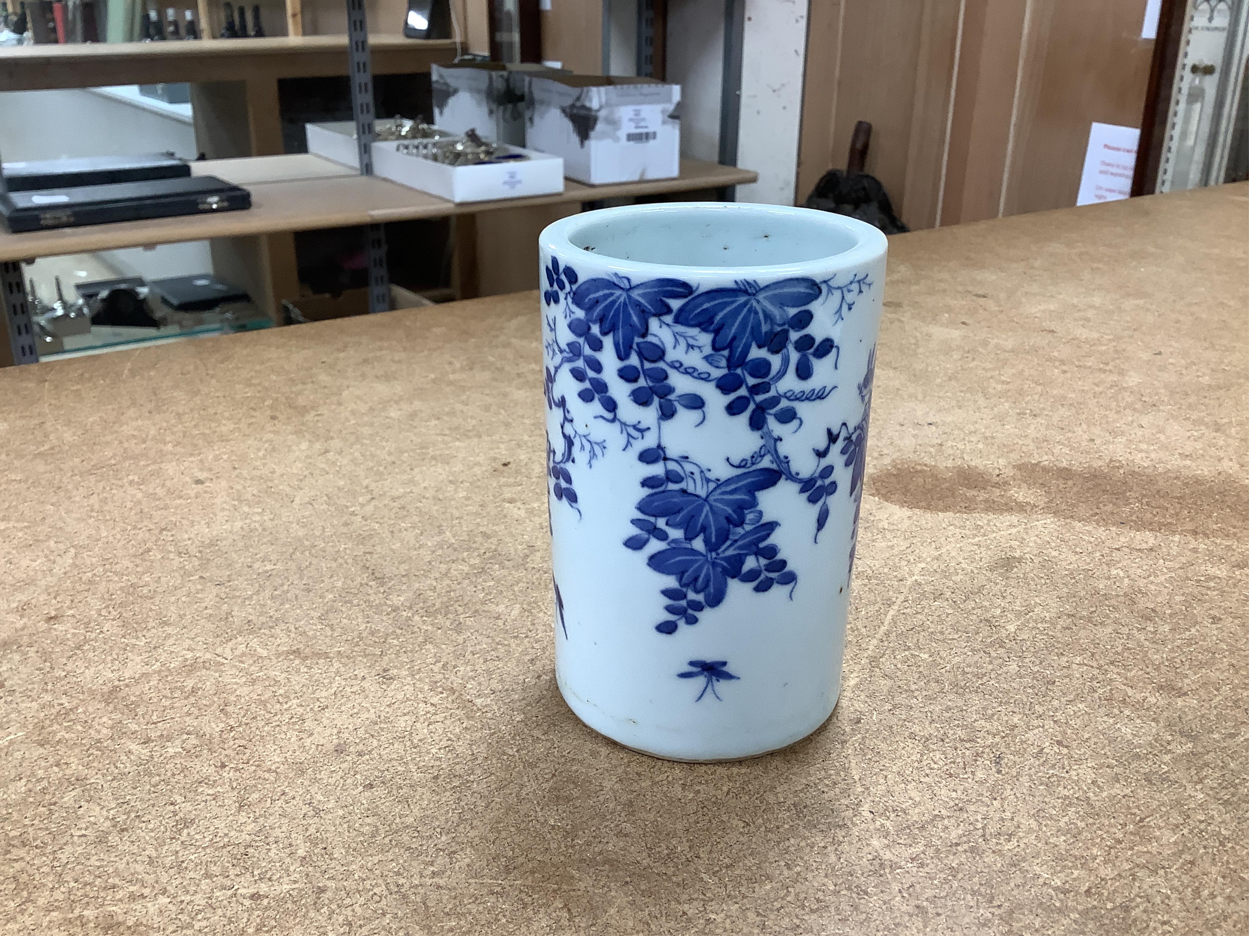 A Chinese blue and white brush pot and famille rose miniature jardiniere, tallest 12cm. Condition - good